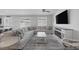 Spacious living room with a large sectional couch and modern TV console at 5966 Icicle Falls Ave, Las Vegas, NV 89130