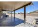 A covered patio features a concrete entertaining area with a beautiful paver extension at 5966 Icicle Falls Ave, Las Vegas, NV 89130