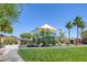Community playground with various play structures, benches and lush greenery, perfect for and families at 5966 Icicle Falls Ave, Las Vegas, NV 89130