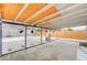Wide shot of covered back patio overlooking pool with a wood fence for privacy at 601 Huntington St, Las Vegas, NV 89107
