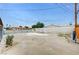 Wide backyard showcases a dated pool with a large concrete patio at 601 Huntington St, Las Vegas, NV 89107