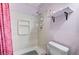 Compact bathroom featuring shower stall, shelving, and a toilet at 601 Huntington St, Las Vegas, NV 89107