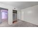 Bedroom featuring white walls, carpet flooring and closet doors with mirrored panels at 601 Huntington St, Las Vegas, NV 89107