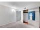 Bright bedroom with white walls, gray carpet flooring, and closet with mirrored doors at 601 Huntington St, Las Vegas, NV 89107