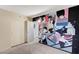Stylish bedroom featuring a distinctive mural, closet, and neutral carpet at 601 Huntington St, Las Vegas, NV 89107