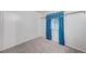 Cozy bedroom with carpet flooring and window dressed with blue floral drapes at 601 Huntington St, Las Vegas, NV 89107