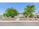 Charming single-story home with mature trees, desert landscaping, and a chain-link fence at 601 Huntington St, Las Vegas, NV 89107