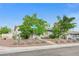A single-story house with desert landscaping and a chain-link fence along the front yard at 601 Huntington St, Las Vegas, NV 89107
