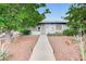 Charming single-story home with desert landscaping, a walkway, and a well-maintained front yard at 601 Huntington St, Las Vegas, NV 89107