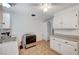 Bright kitchen includes white cabinets, tile flooring, and white appliances at 601 Huntington St, Las Vegas, NV 89107