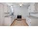 Bright kitchen features white cabinets, gray counters, and tile floors at 601 Huntington St, Las Vegas, NV 89107