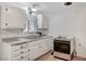 Bright kitchen featuring white cabinets and a stainless steel sink at 601 Huntington St, Las Vegas, NV 89107