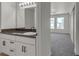 Bathroom with a vanity, mirror, and open doorway to the bedroom at 6117 Daisy Lee Ave, Las Vegas, NV 89108