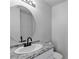 Bathroom featuring stylish lighting, white cabinets, and a granite countertop at 6117 Daisy Lee Ave, Las Vegas, NV 89108