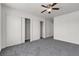 Bedroom featuring carpeted floors, a ceiling fan, and a closet with sliding doors at 6117 Daisy Lee Ave, Las Vegas, NV 89108