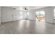 Open living area features large windows, contemporary flooring, and access to the backyard through sliding doors at 6117 Daisy Lee Ave, Las Vegas, NV 89108