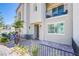 Charming townhome featuring a cozy front patio and a private balcony above at 6819 Citron Mist Ct, North Las Vegas, NV 89086