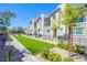 A row of modern townhomes with private patios and lush landscaping at 6819 Citron Mist Ct, North Las Vegas, NV 89086