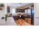 Modern kitchen featuring dark cabinetry, granite countertops, and stainless steel appliances at 6819 Citron Mist Ct, North Las Vegas, NV 89086