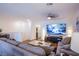 Relaxing living area featuring a large-screen TV, contemporary decor, and comfortable seating at 6819 Citron Mist Ct, North Las Vegas, NV 89086