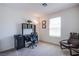 Bright office space featuring a desk with shelving, comfortable chair, and natural light at 6819 Citron Mist Ct, North Las Vegas, NV 89086