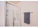 Bathroom shower with a glass door and tile surround at 6819 Citron Mist Ct, North Las Vegas, NV 89086