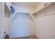 Functional walk-in closet with shelving and racks for efficient storage and organization at 6819 Citron Mist Ct, North Las Vegas, NV 89086