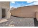 Low maintenance backyard featuring dark gravel and a block wall for privacy at 69 Ella Ashman Ave, Henderson, NV 89011
