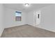 This bedroom features carpet, a window, and attached bath at 69 Ella Ashman Ave, Henderson, NV 89011
