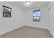 Bedroom with two windows providing natural light and a closet with sliding doors at 69 Ella Ashman Ave, Henderson, NV 89011