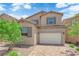 Charming two-story home featuring a brick driveway and neutral color palette at 69 Ella Ashman Ave, Henderson, NV 89011