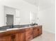 Modern bathroom with dual sinks, clean lines, and sleek fixtures at 6901 Whisper Canyon Pl, North Las Vegas, NV 89084