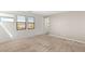 Bright bedroom with soft carpet, two windows, and ample natural light at 6901 Whisper Canyon Pl, North Las Vegas, NV 89084