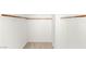 Walk-in closet with shelving and wood rails in the main bedroom at 6901 Whisper Canyon Pl, North Las Vegas, NV 89084