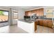 Modern kitchen with stainless steel appliances, quartz countertops, and custom cabinets at 6901 Whisper Canyon Pl, North Las Vegas, NV 89084