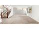 Spacious living room with lots of natural light and a staircase at 6901 Whisper Canyon Pl, North Las Vegas, NV 89084