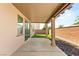 Covered patio with direct access to grassy backyard and outdoor living space at 6901 Whisper Canyon Pl, North Las Vegas, NV 89084