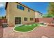 Backyard with artificial turf area, picnic table, patio, and gravel landscaping for low-maintenance appeal at 7372 S Palo Real Ct, Las Vegas, NV 89179