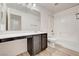 Bathroom featuring vanity with dark cabinetry, a toilet, and shower/tub combo at 7372 S Palo Real Ct, Las Vegas, NV 89179