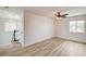 Spacious bedroom with ample natural light and wood-look flooring at 7372 S Palo Real Ct, Las Vegas, NV 89179
