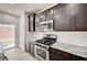 Modern kitchen featuring stainless steel appliances and granite countertops at 7372 S Palo Real Ct, Las Vegas, NV 89179
