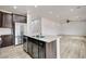 Bright eat in kitchen with stainless steel appliances with view of the living room at 7372 S Palo Real Ct, Las Vegas, NV 89179