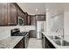 Modern eat in kitchen with subway tile backsplash, stainless appliances and kitchen island at 7372 S Palo Real Ct, Las Vegas, NV 89179