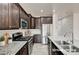 Modern kitchen featuring stainless appliances, granite countertops, and subway tile backsplash at 7372 S Palo Real Ct, Las Vegas, NV 89179