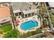 Backyard oasis with pool, patio, and green landscaping creating a private retreat, perfect for relaxing and entertaining at 7920 Aspect Way, Las Vegas, NV 89149