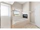 Bathroom boasts a jacuzzi tub, shower, and bright window at 7920 Aspect Way, Las Vegas, NV 89149
