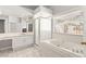 Bright bathroom with a soaking tub, walk-in shower, and a double vanity at 7920 Aspect Way, Las Vegas, NV 89149