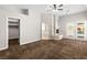 Large primary bedroom with a fireplace, doors to the pool, and a walk-in closet at 7920 Aspect Way, Las Vegas, NV 89149