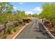 Gated community entrance with well-manicured landscaping offering privacy and exclusivity at 7920 Aspect Way, Las Vegas, NV 89149