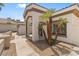 Beautiful home exterior with lush landscaping, including palm trees and gravel, providing great curb appeal at 7920 Aspect Way, Las Vegas, NV 89149